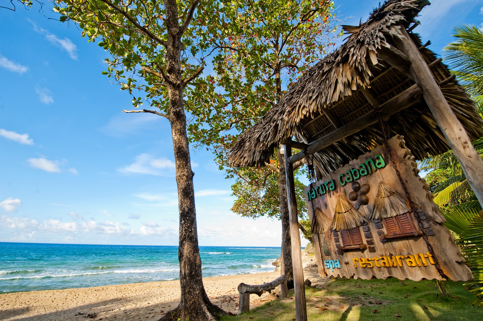 natura-cabana-hotel-sign-on-beach