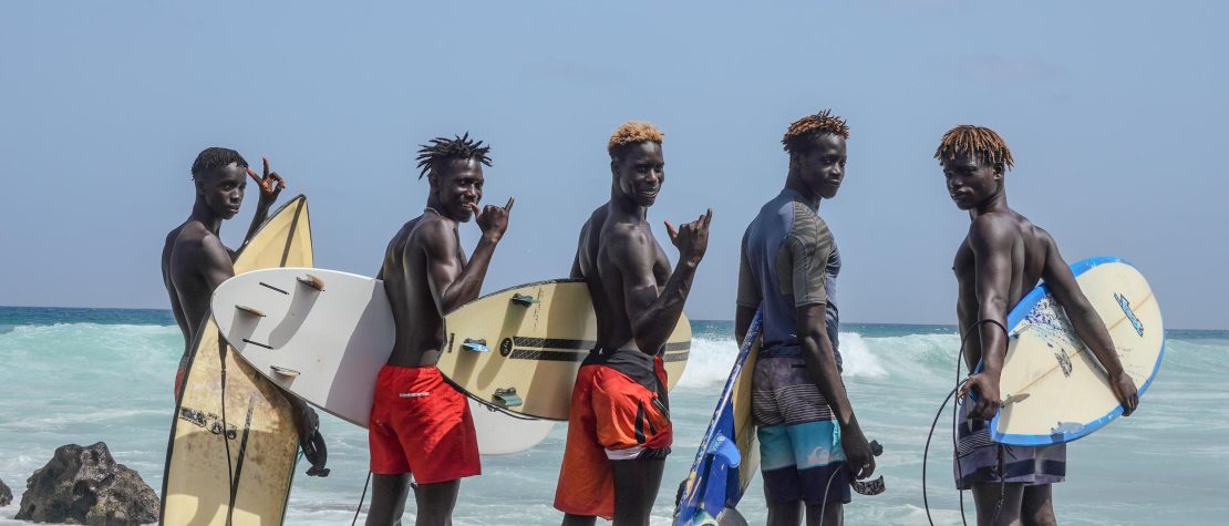 Babacar Thiaw with surfboards in Senegal